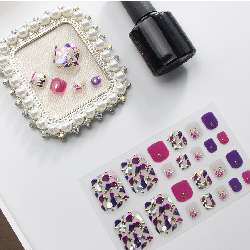 Purple pedicure sticker sheets with decorative patterns