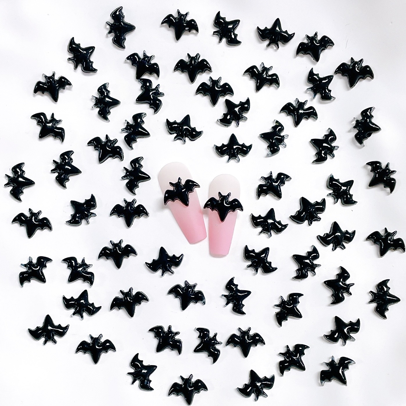 Small black bat-shaped resin decorations